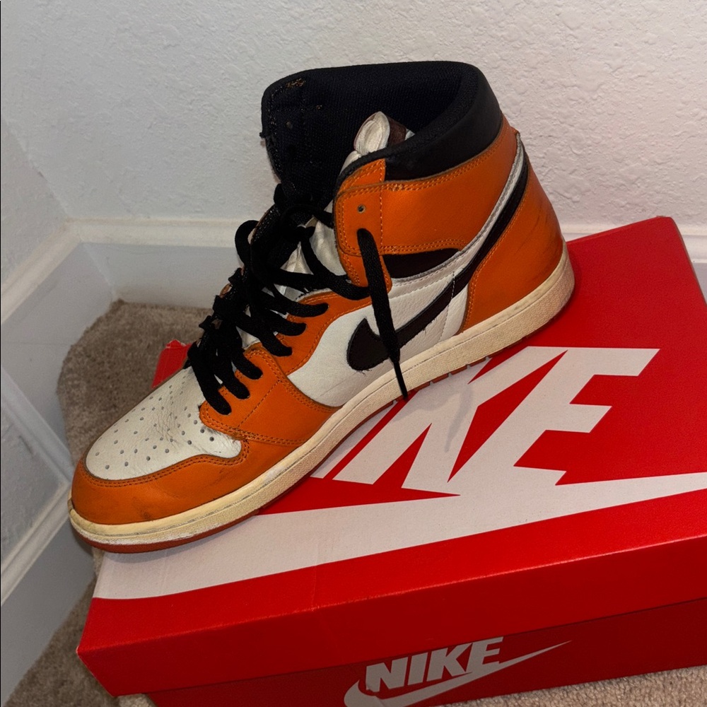 Nike High-Top Sneakers in Orange, White, and Black